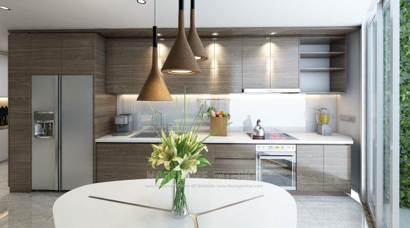 Thiết kế tủ bếp gỗ Laminate cho chung cư hiện đại. Để tạo nên không gian bếp ấn tượng, sạch sẽ và rộng rãi, gia chủ đã lựa chọn sử dụng đá ốp bên màu trắng solid surface cao cấp góp phần tạo nên một không gian bếp đẹp mắt